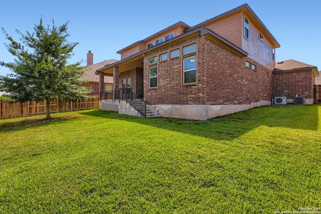 a view of backyard with green space