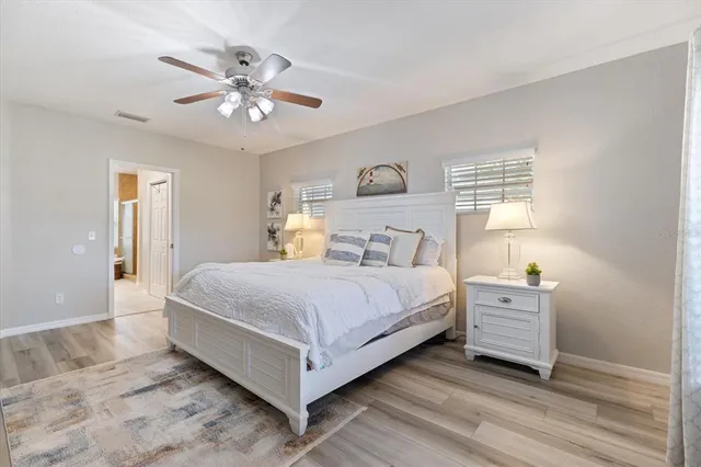 a spacious bathroom with a double vanity sink a mirror and a bathtub
