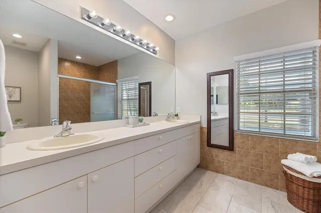 a bedroom with furniture and a book shelf