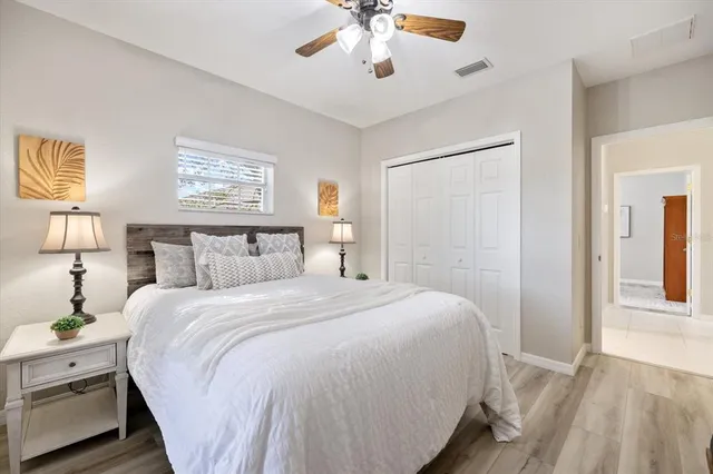 a bedroom with furniture and a window