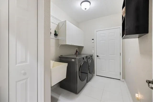 a dining room with furniture and a floor to ceiling window
