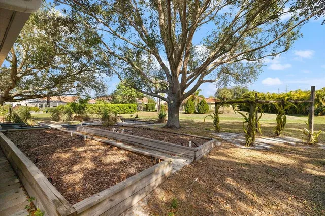 an aerial view of residential building and lake