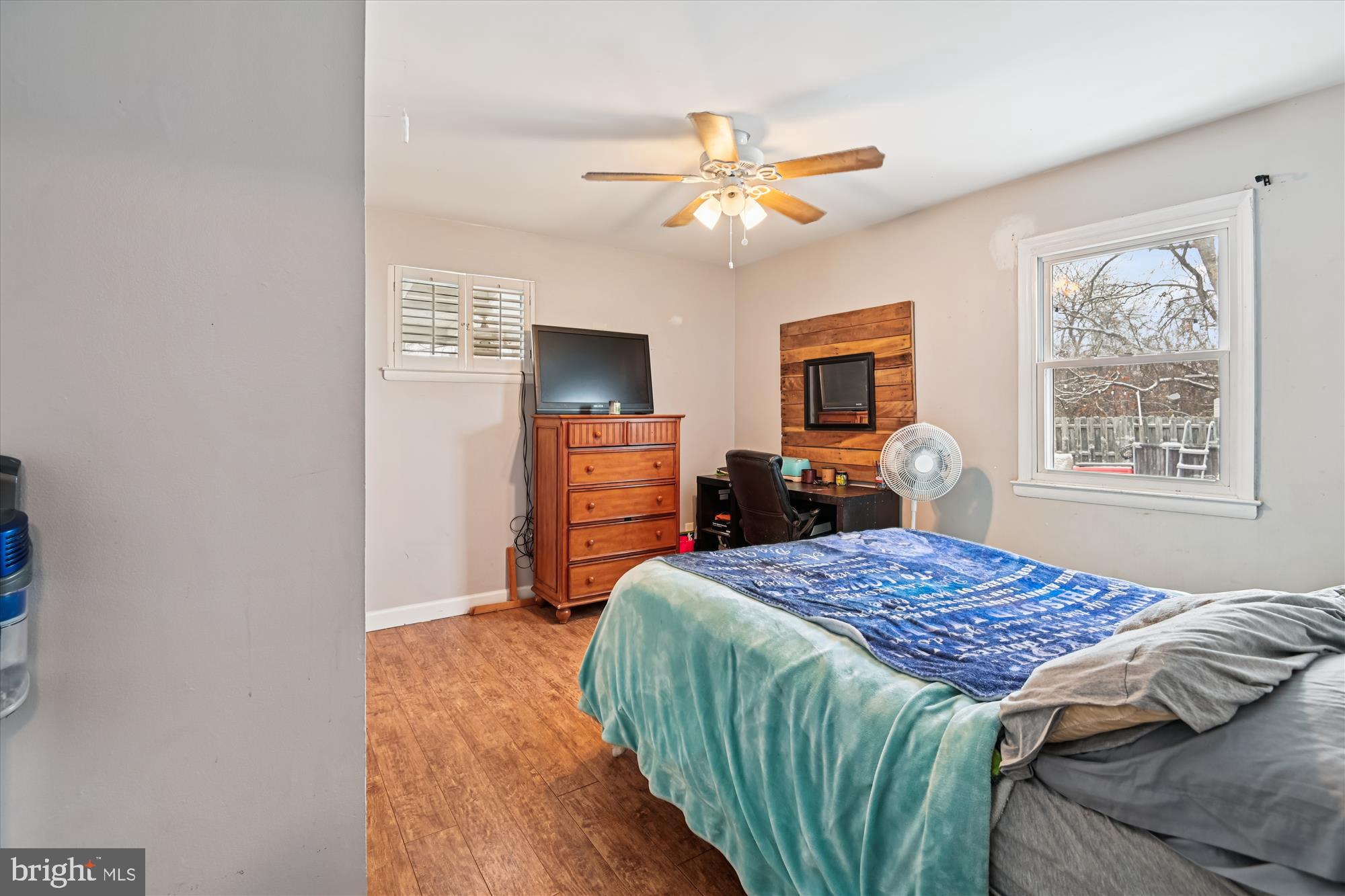 1091 Notley Court Pasadena, MD 21122 - Photo 15 of 36 a bedroom with a bed and a chandelier