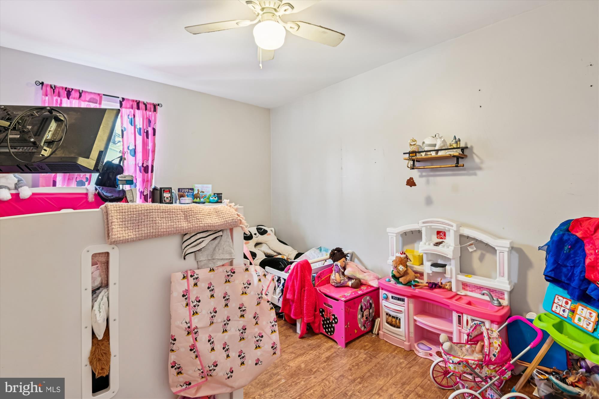 1091 Notley Court Pasadena, MD 21122 - Photo 20 of 36 a bedroom with furniture and a chandelier