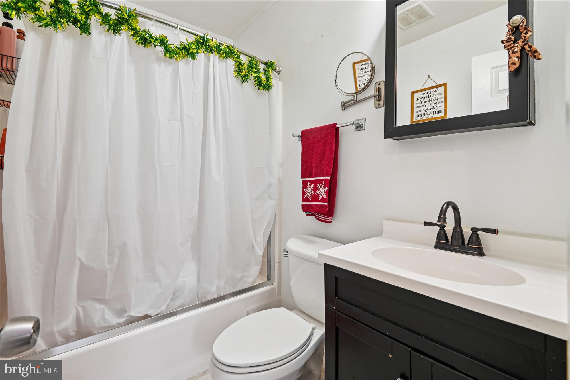1091 Notley Court Pasadena, MD 21122 - Photo 27 of 36 a bathroom with a sink vanity mirror and toilet