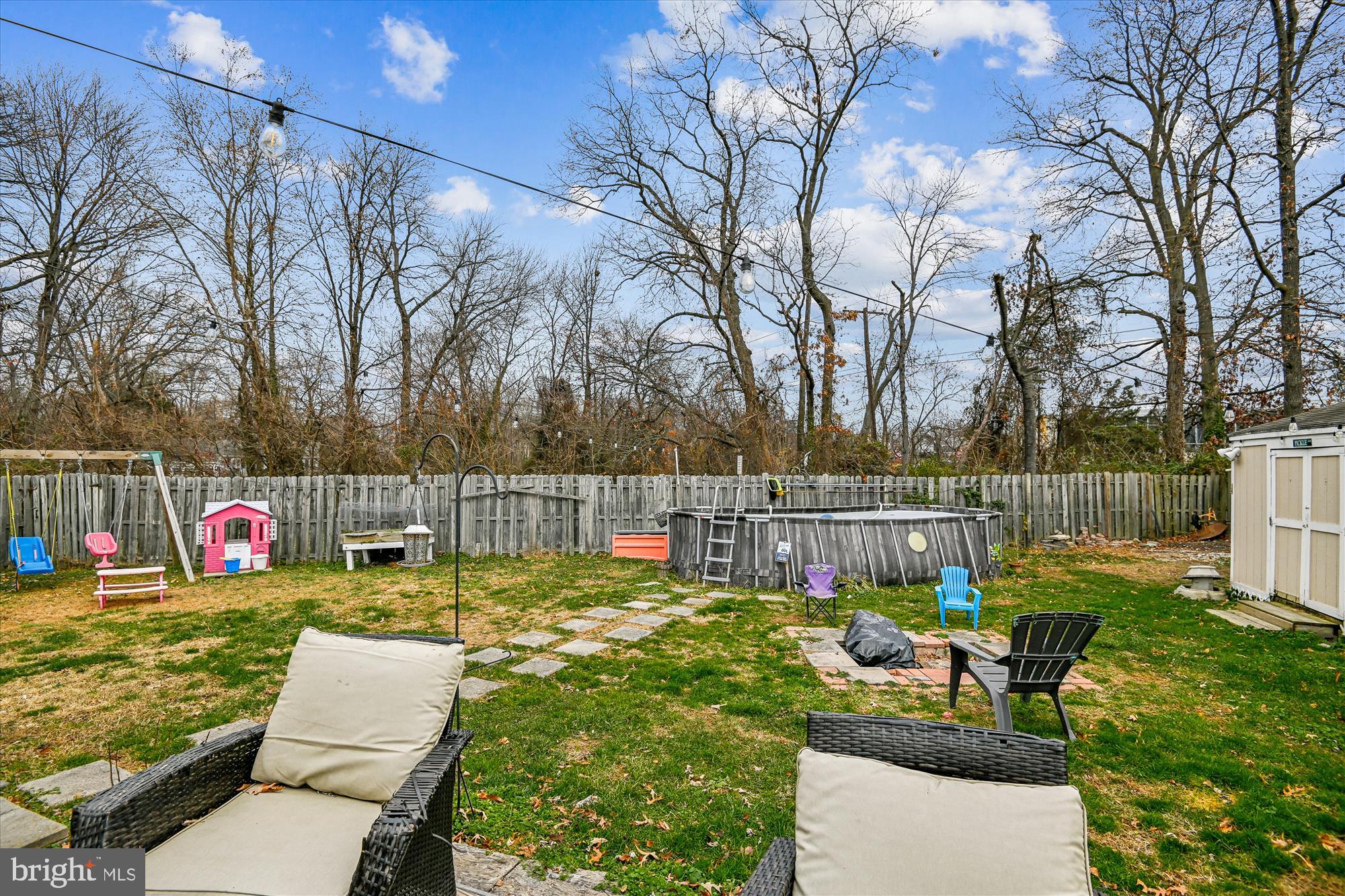 1091 Notley Court Pasadena, MD 21122 - Photo 31 of 36 a view of swimming pool with chairs and garden