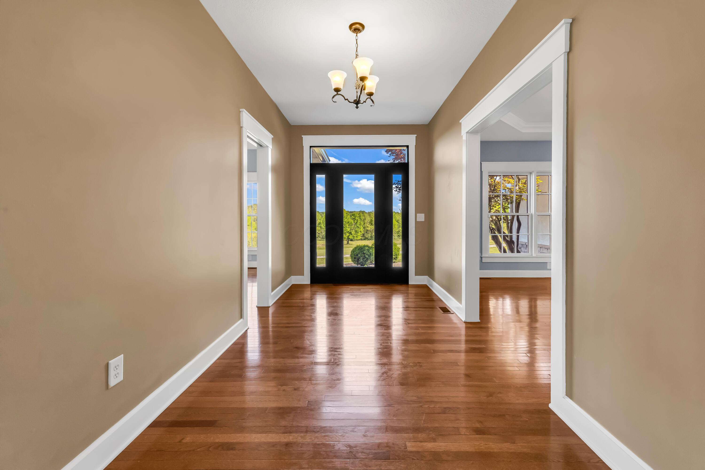 16689 Bailor Road Laurelville, OH 43135 - Photo 5 of 73 • Hardwood flooring
• Tan painted walls
• Leaded glass front door
with sidelights
• Chandelier
• Coat closet
• New front door ~ 2026