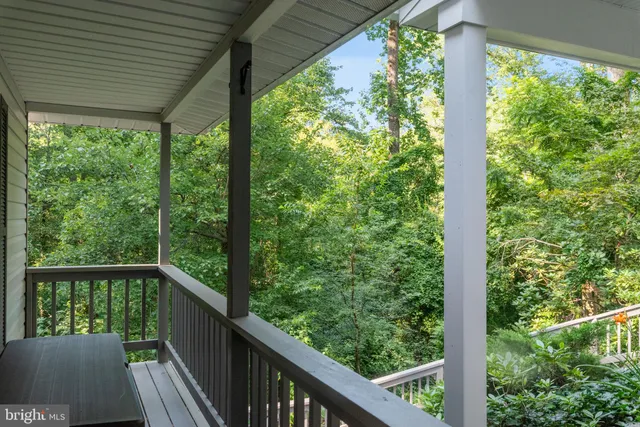 a view of balcony with furniture and wooden deck