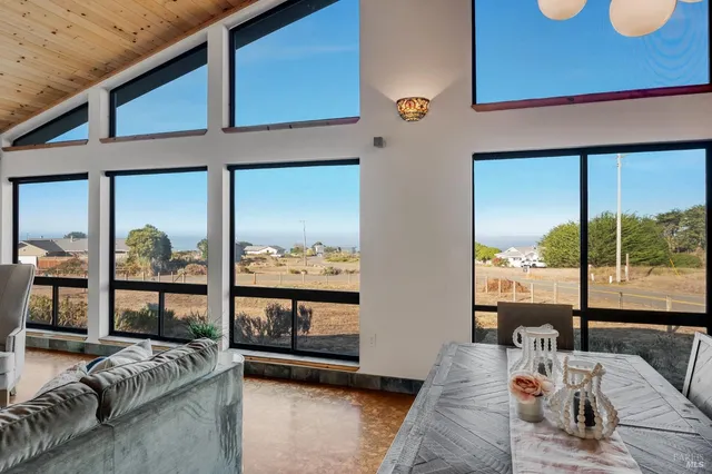 a balcony view with furniture and a large window