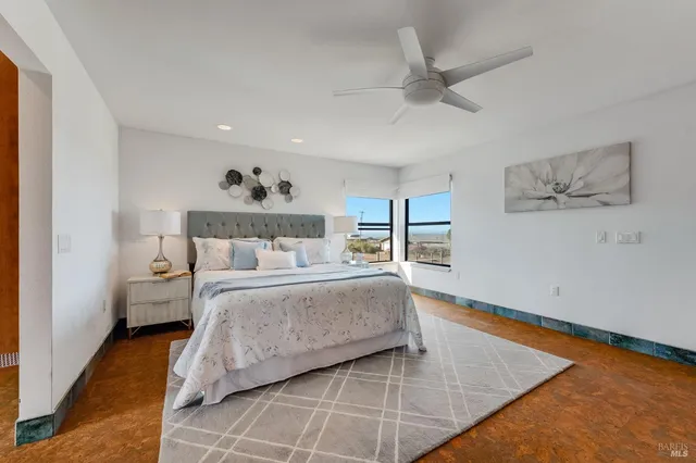 a bedroom with a bed and cabinet