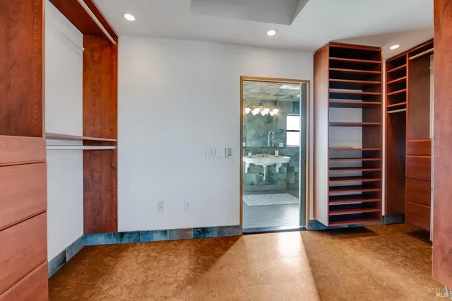 a bathroom with a sink mirror and toilet