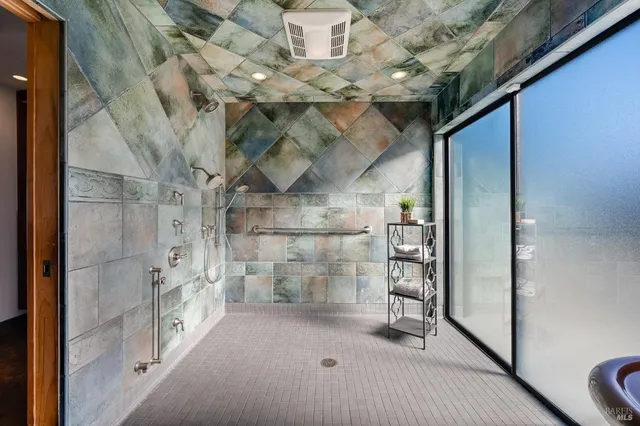 a view of a bathroom with a sink and mirror