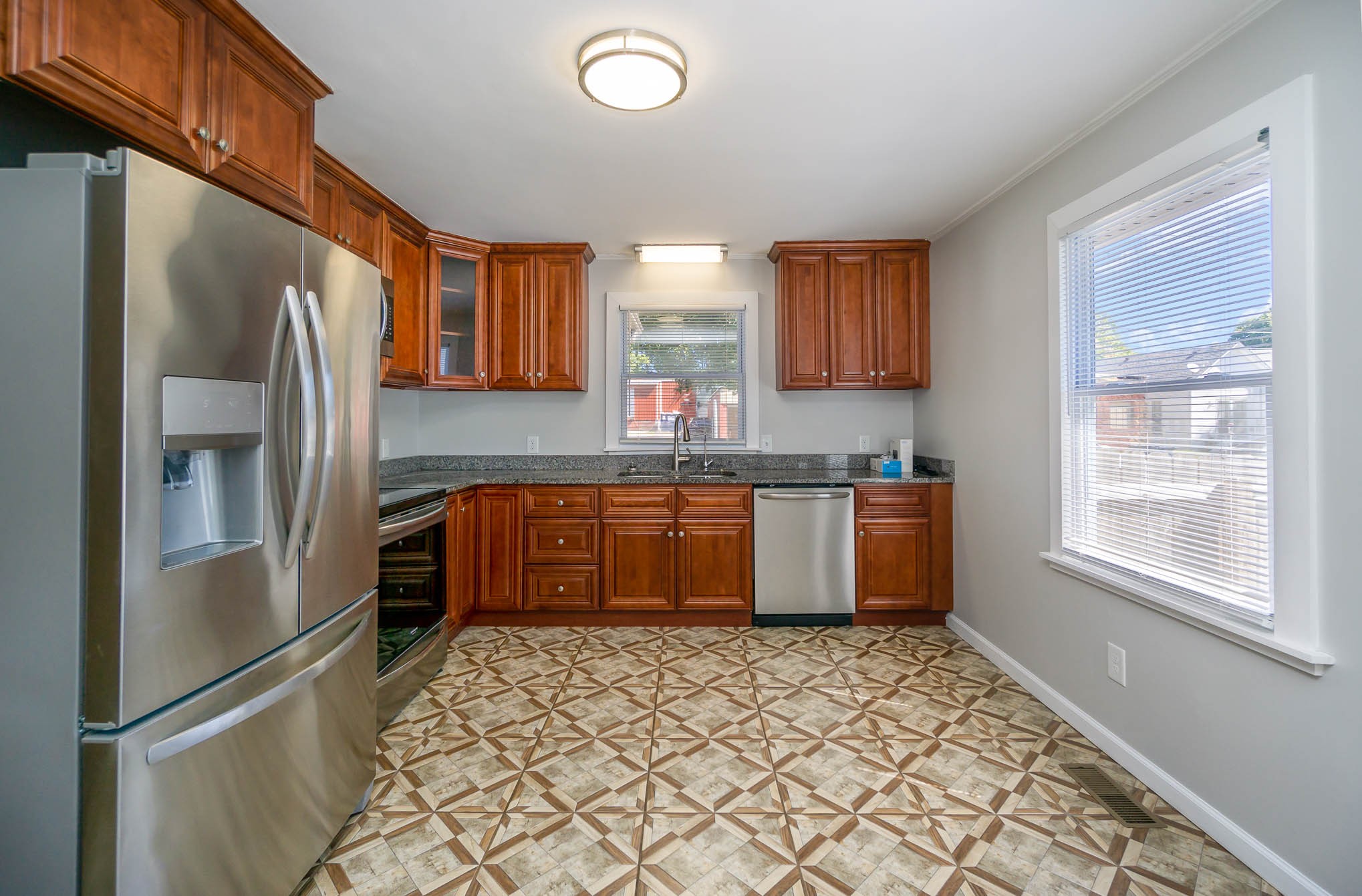 106 Jordan Avenue Mount Pleasant, TN 38474 - Photo 11 of 30 a kitchen with stainless steel appliances granite countertop a refrigerator and a sink