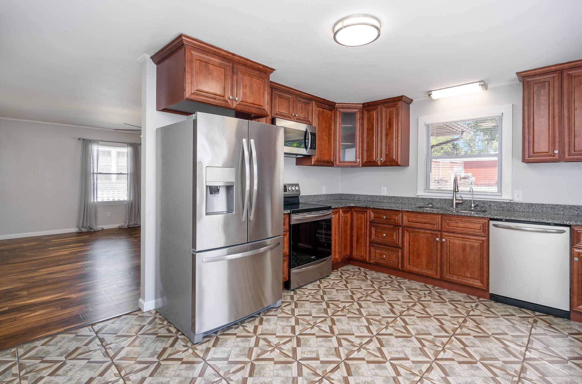 106 Jordan Avenue Mount Pleasant, TN 38474 - Photo 14 of 30 a kitchen with stainless steel appliances granite countertop a refrigerator and a sink