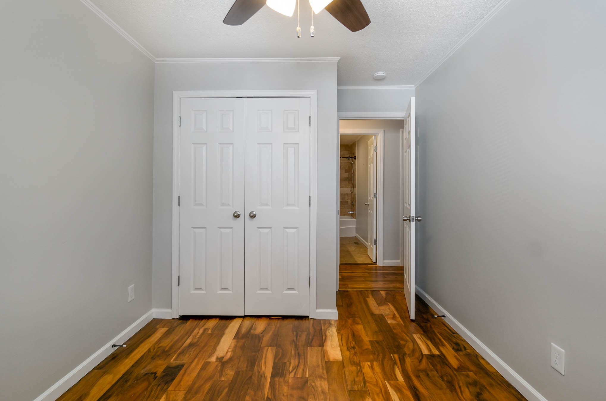 106 Jordan Avenue Mount Pleasant, TN 38474 - Photo 19 of 30 a view of an empty room with window and wooden floor