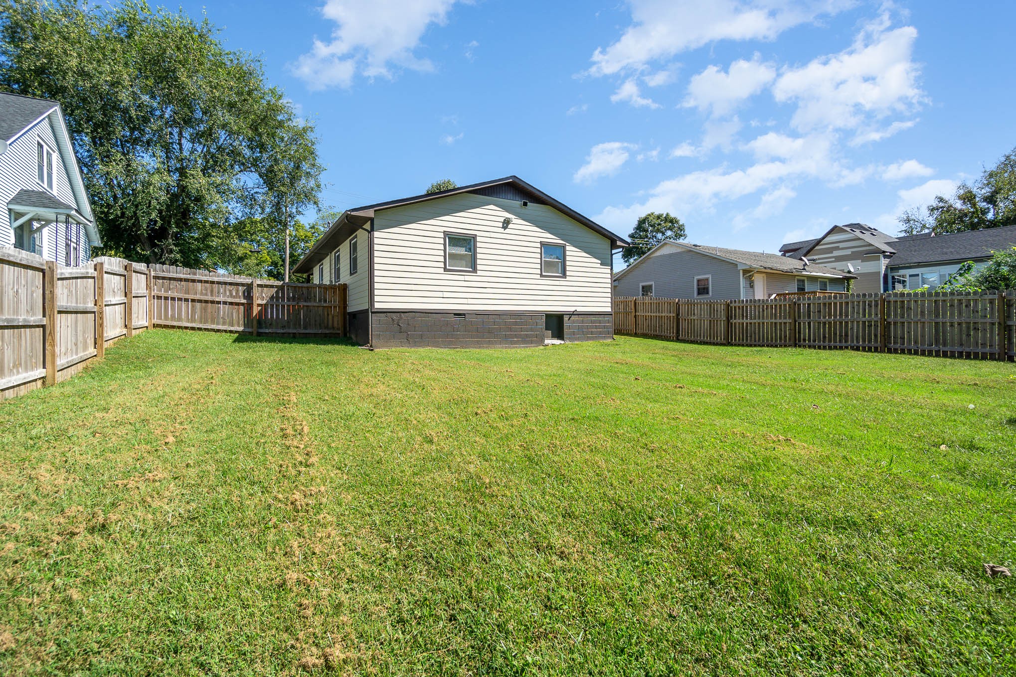 106 Jordan Avenue Mount Pleasant, TN 38474 - Photo 28 of 30 a view of a house with a yard and large tree