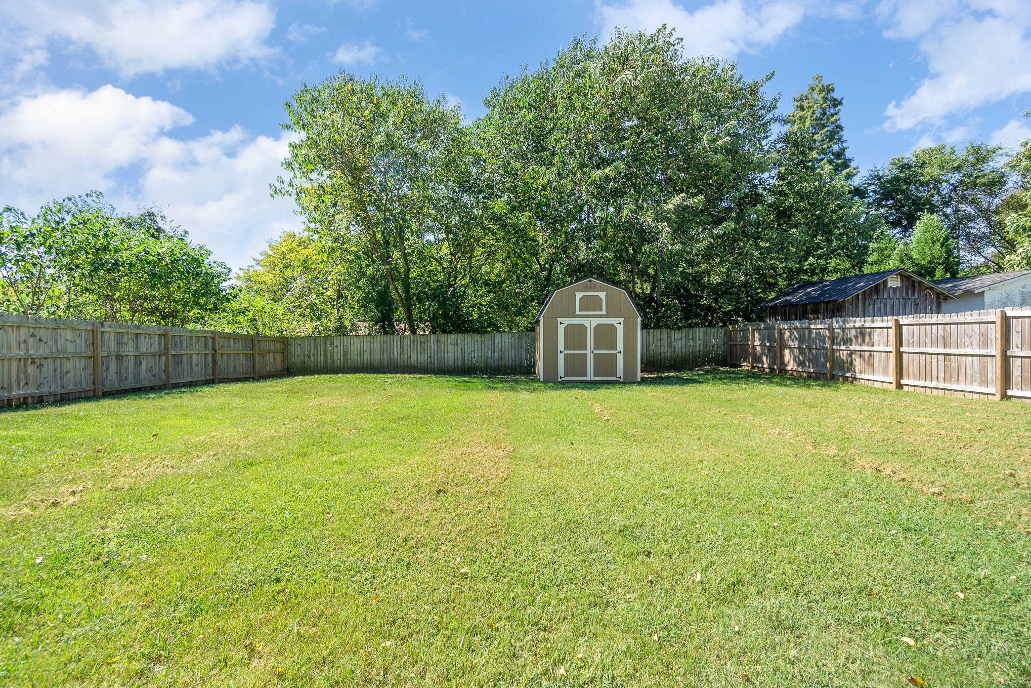 106 Jordan Avenue Mount Pleasant, TN 38474 - Photo 29 of 30 a swimming pool with wooden fence