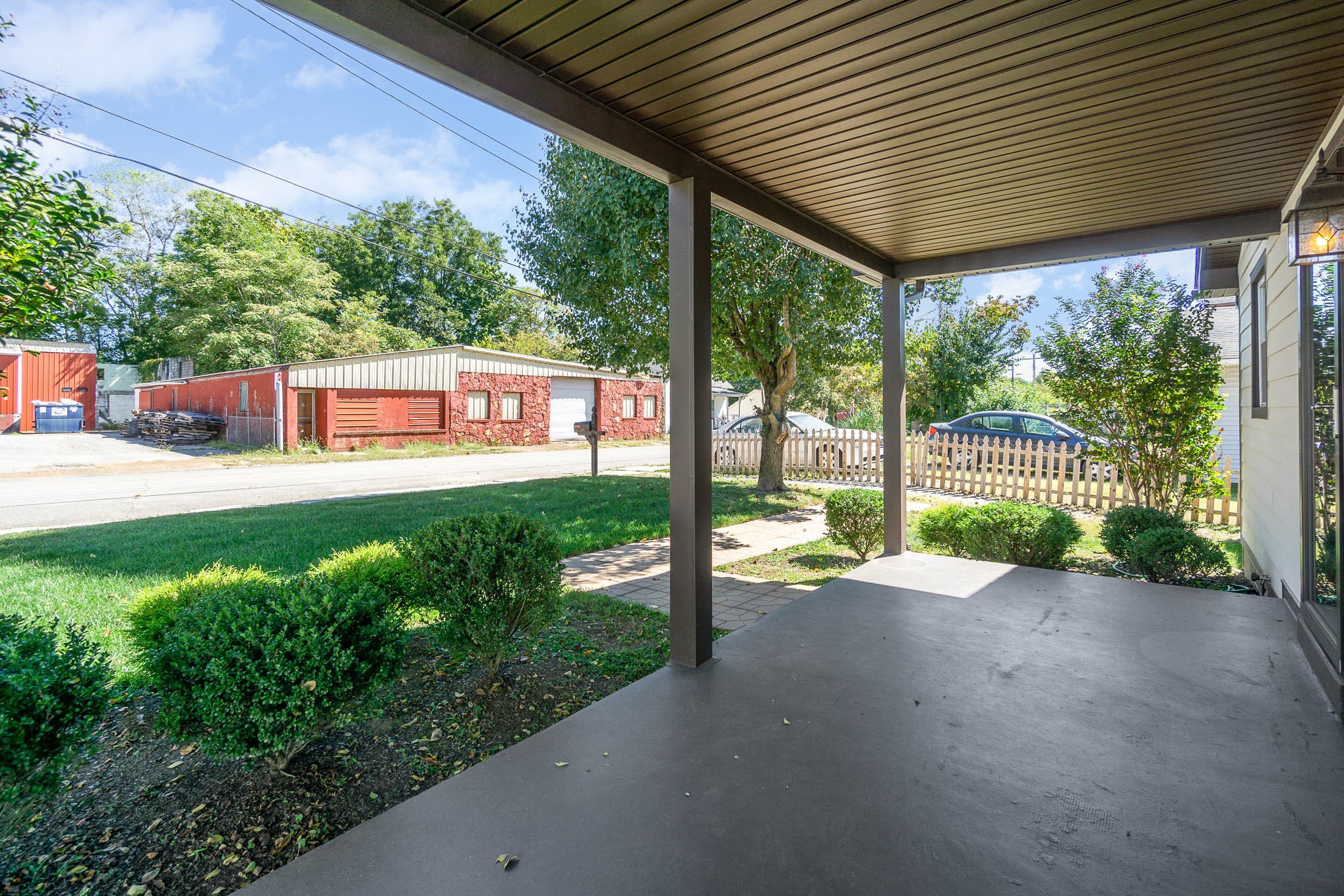 106 Jordan Avenue Mount Pleasant, TN 38474 - Photo 4 of 30 a view of a house with backyard and porch