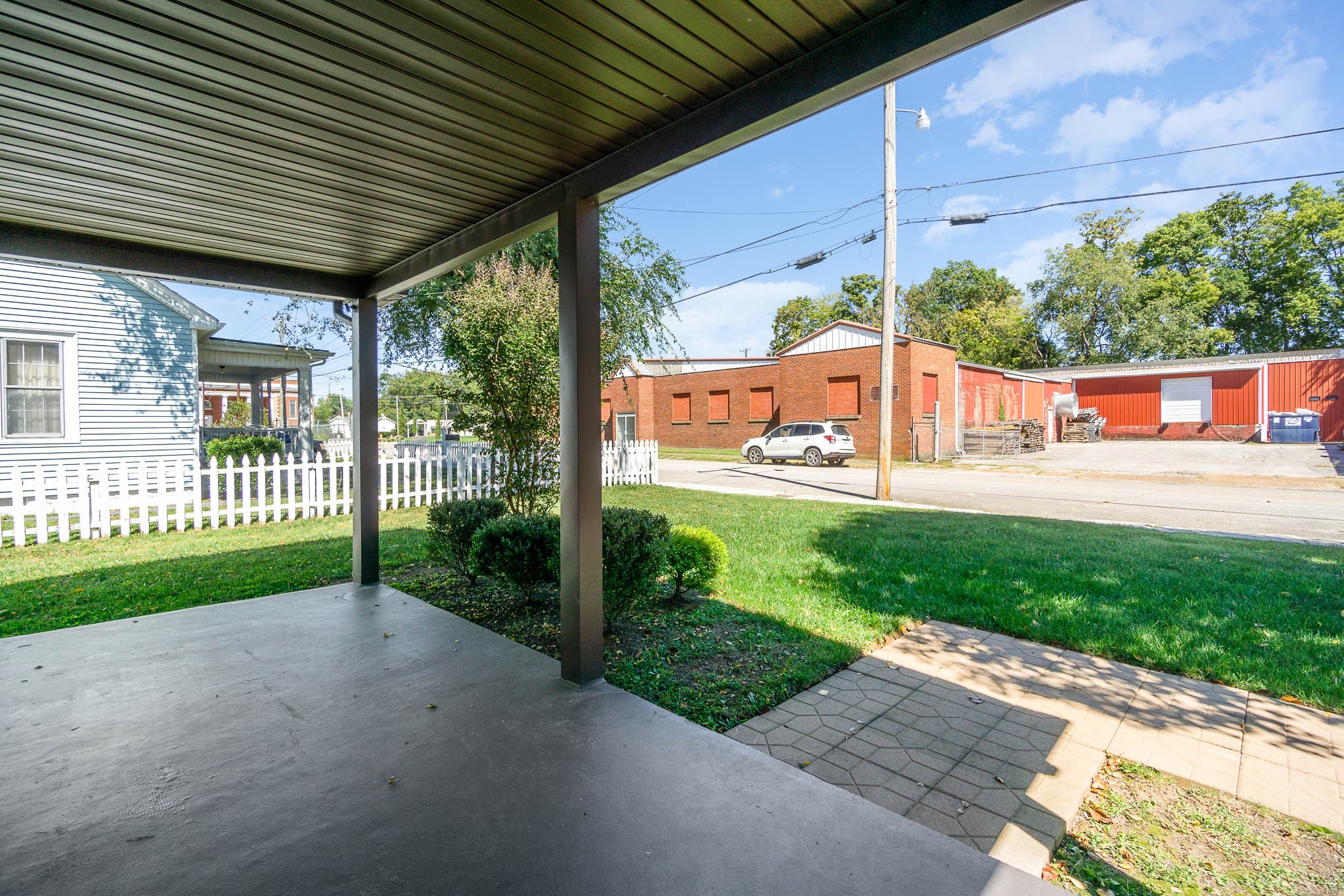 106 Jordan Avenue Mount Pleasant, TN 38474 - Photo 6 of 30 a view of a porch with a backyard