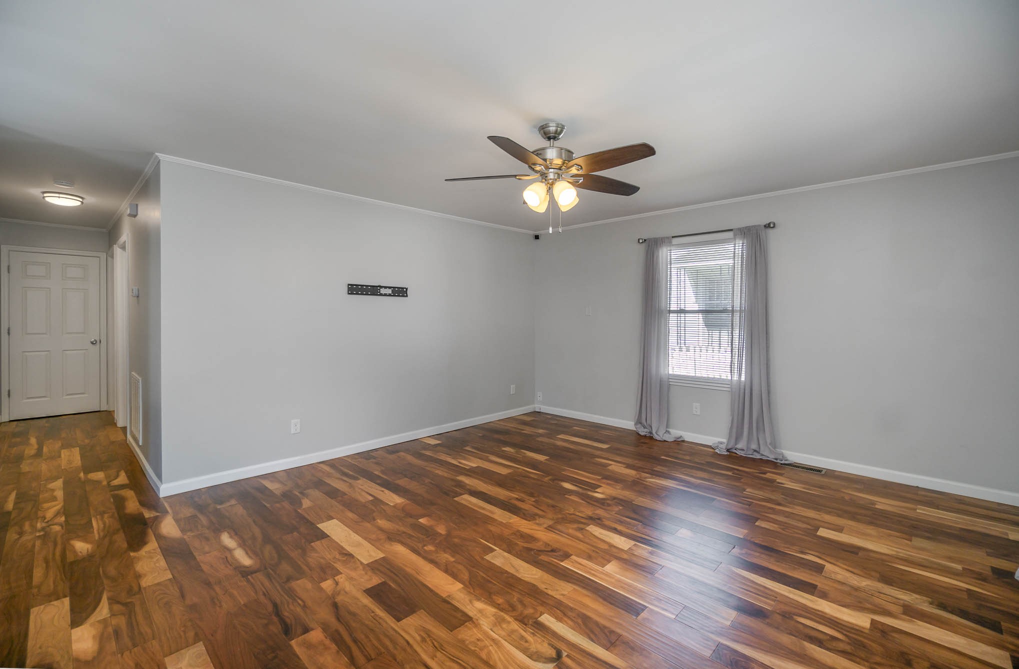 106 Jordan Avenue Mount Pleasant, TN 38474 - Photo 8 of 30 a view of empty room with window and ceiling fan
