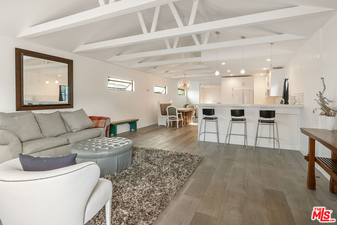 754 Washington Boulevard Marina del Rey, CA 90292 - Photo 2 of 16 a living room with furniture and view of kitchen