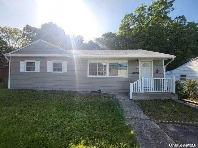 a view of a house with a yard and deck