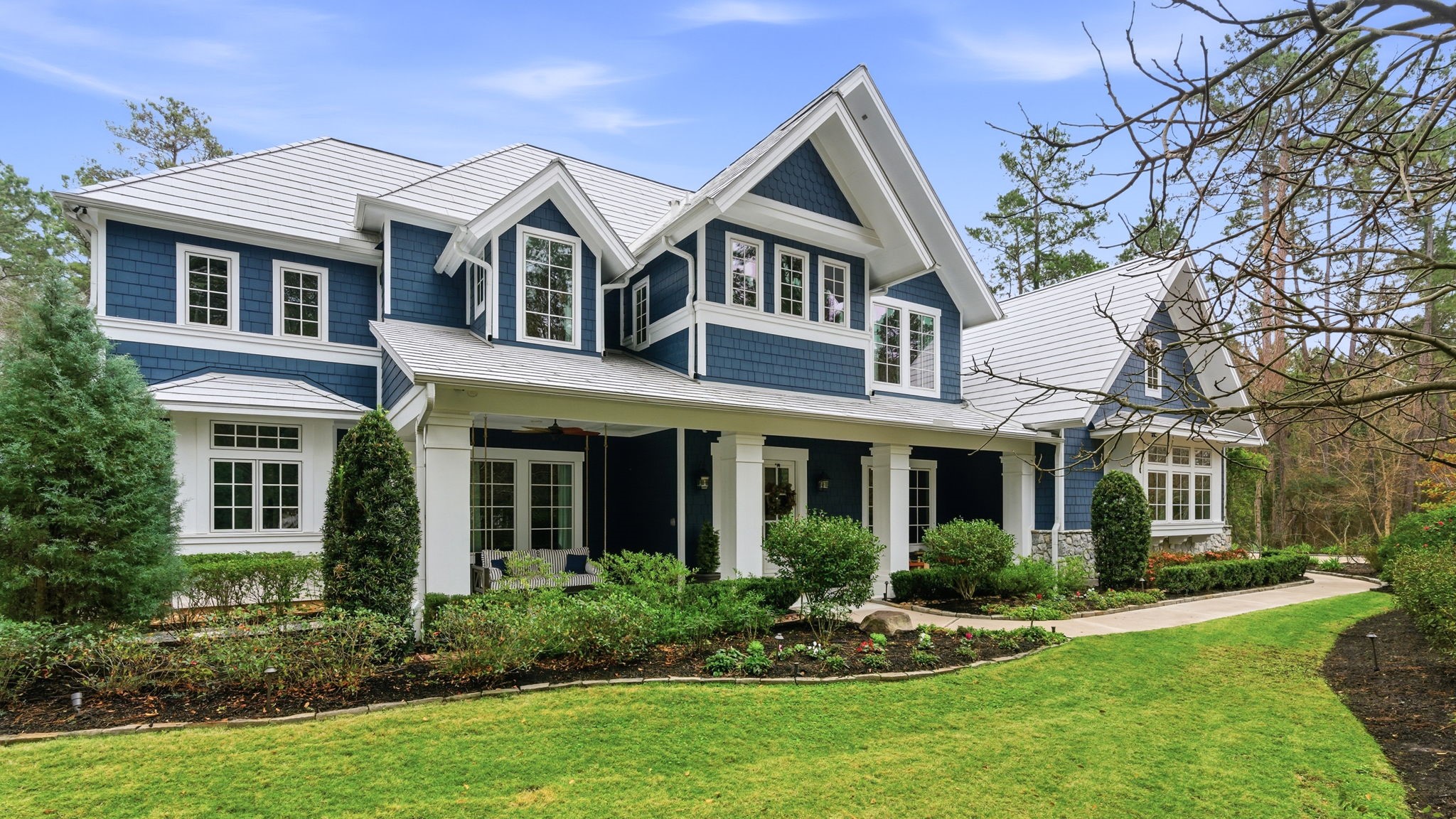 Discover a serene five-acre retreat that perfectly blends peaceful country living with modern luxury in this stunning Cape Cod-style estate, nestled within a gated equestrian friendly neighborhood of Ranches at Pinehurst, just minutes from The Woodlands.