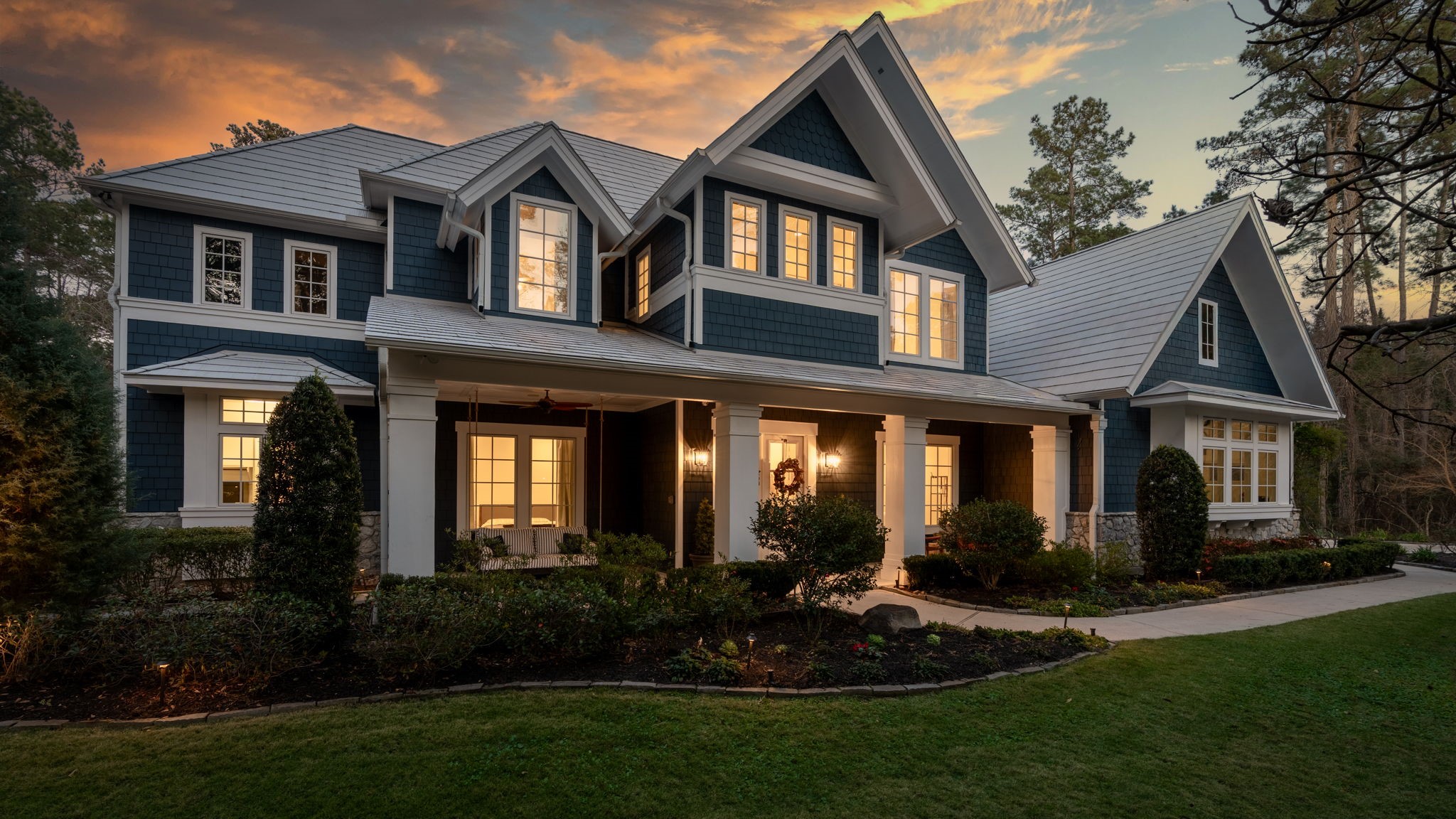 10 Riata Drive Magnolia, TX 77354 - Photo 2 of 48 From the moment you arrive, the home captivates with its charming blue siding, crisp white metal roof, and undeniable curb appeal. A 50-yr metal shingle roof with Tech shield radiant barrier is featured.