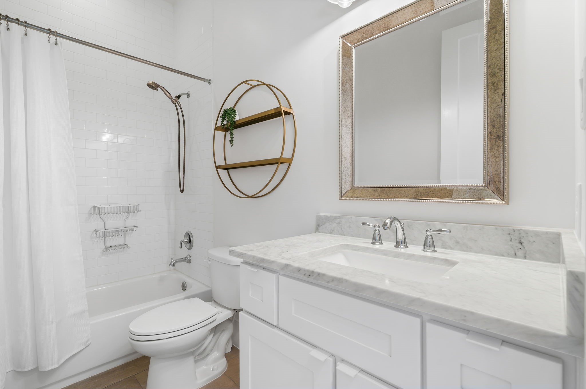 10 Riata Drive Magnolia, TX 77354 - Photo 24 of 48 This full bath is located adjacent to the flex room and has Carrera marble counters, chrome fixtures and subway tile shower walls.