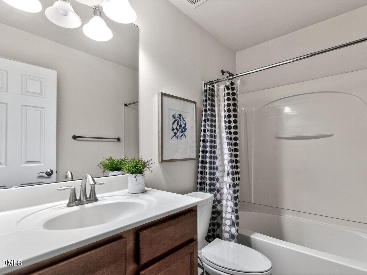 8215 Yaxley Hall Drive Raleigh, NC 27616 - Photo 26 of 42 a bathroom with a sink toilet and shower