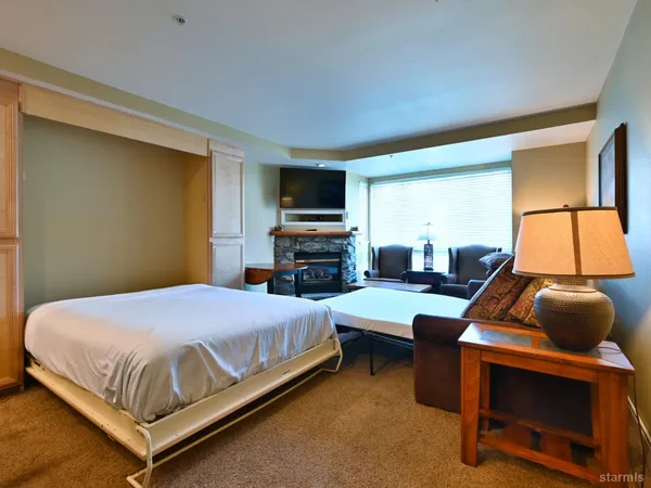 a room with furniture and a fireplace