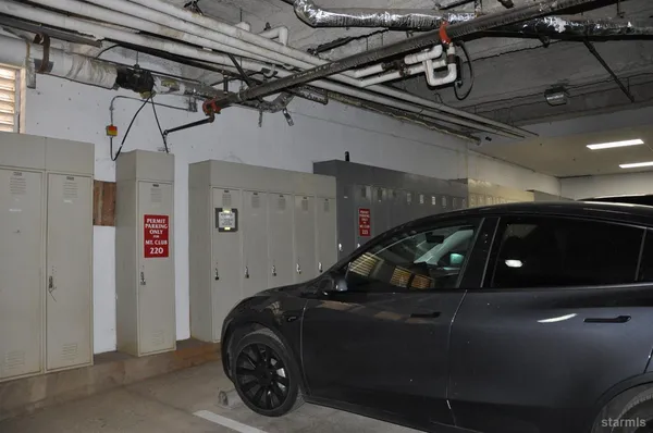 a view of building along with the road and shops