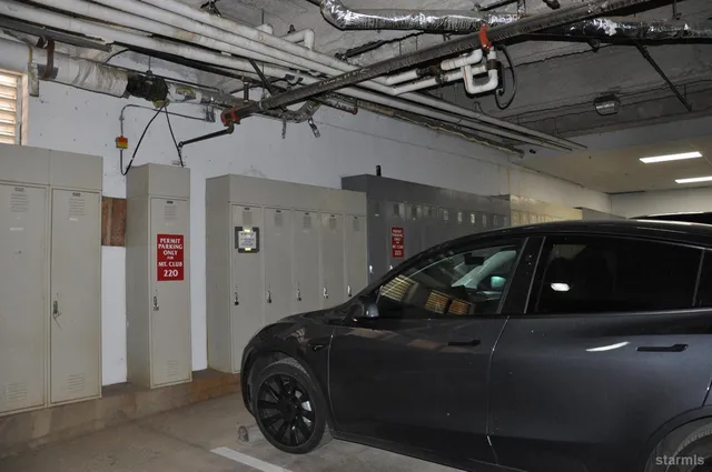 a view of building along with the road and shops