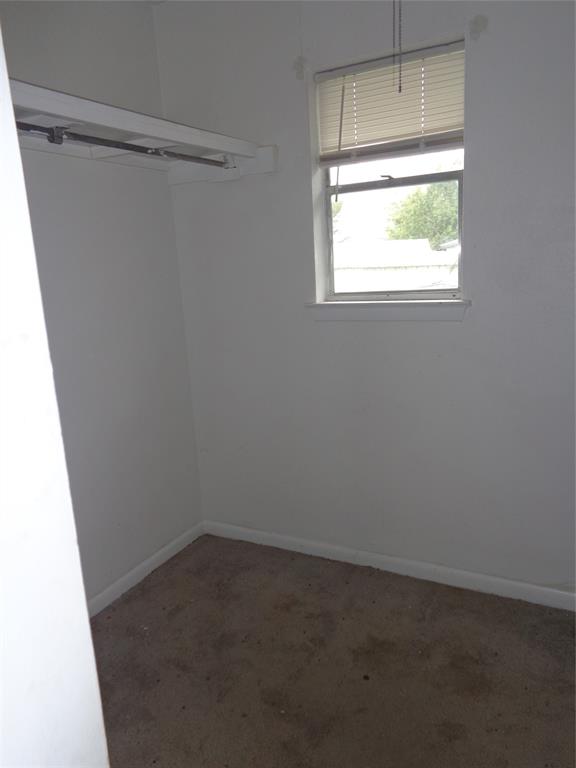 612 South Files Street Itasca, TX 76055 - Photo 10 of 30 Empty room featuring baseboards and carpet floors