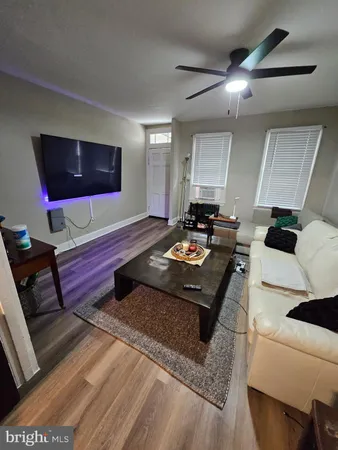 a living room with a couch and a flat screen tv