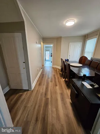 a view of a livingroom with furniture and wooden floor