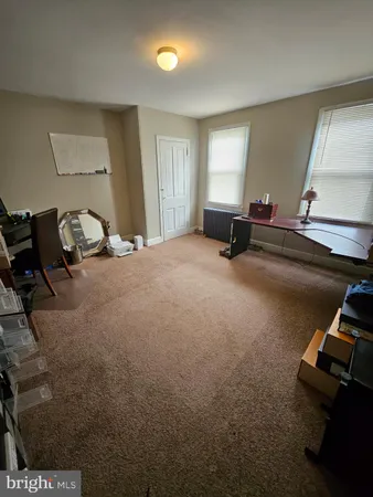 a room with gym equipment and a window