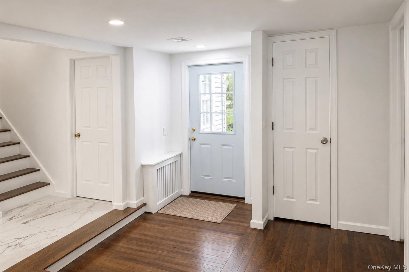 80 Mt Pleasant Road Smithtown, NY 11787 - Photo 4 of 27 a view of an empty room with wooden floor and a window