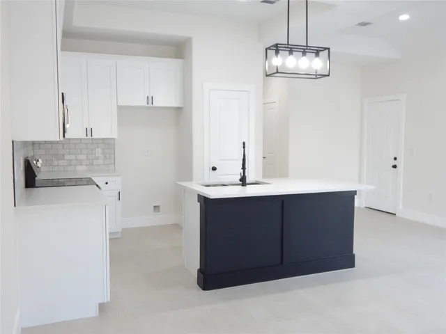 a bathroom with a sink vanity and a mirror