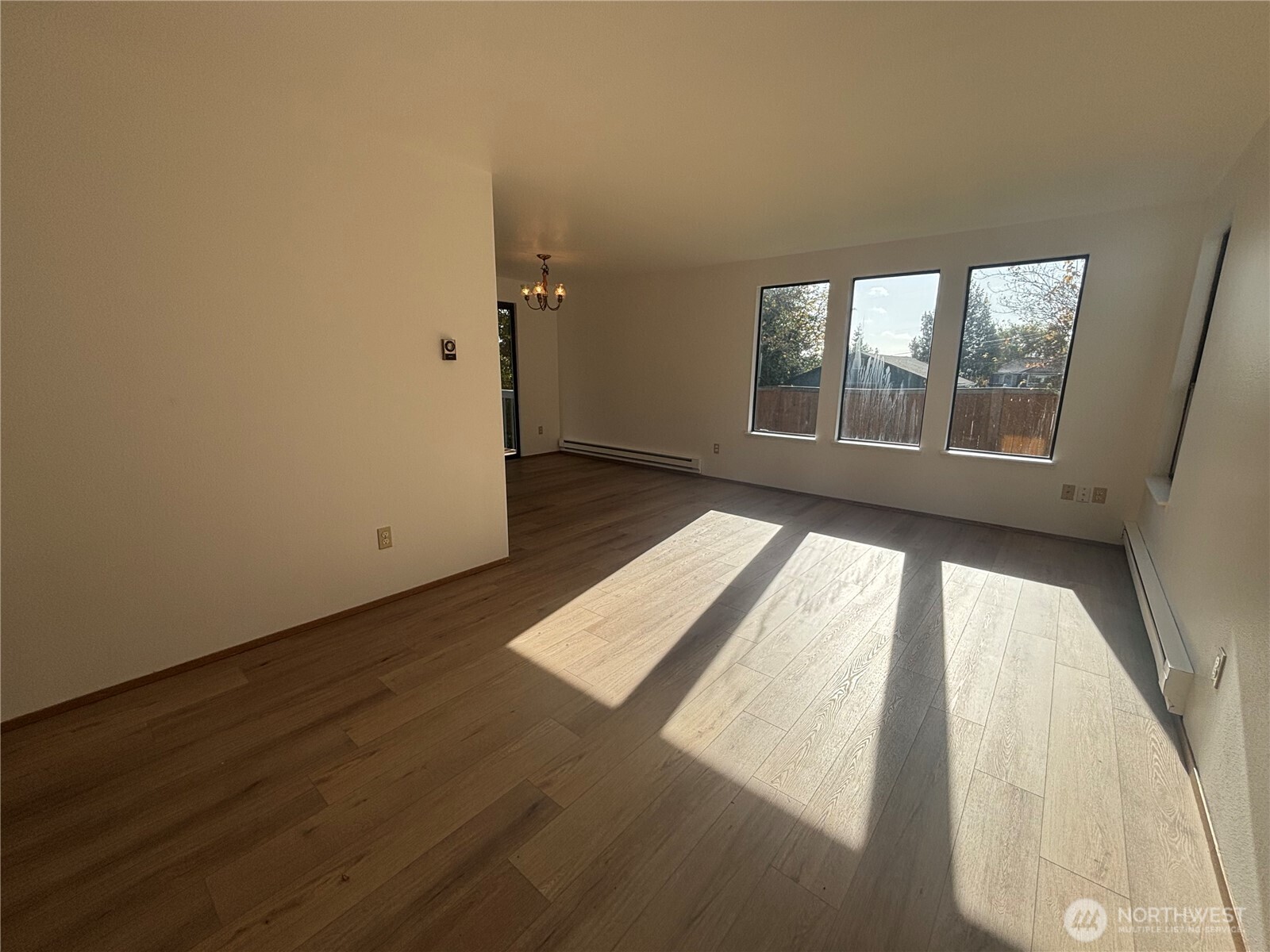 2638 Cascade Trail, Unit A Bremerton, WA 98310 - Photo 2 of 13 an empty room with wooden floor and windows