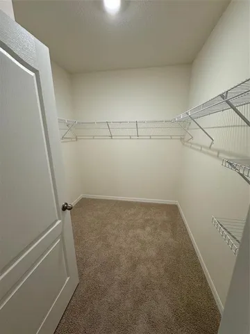 a view of a room with racks on the wall