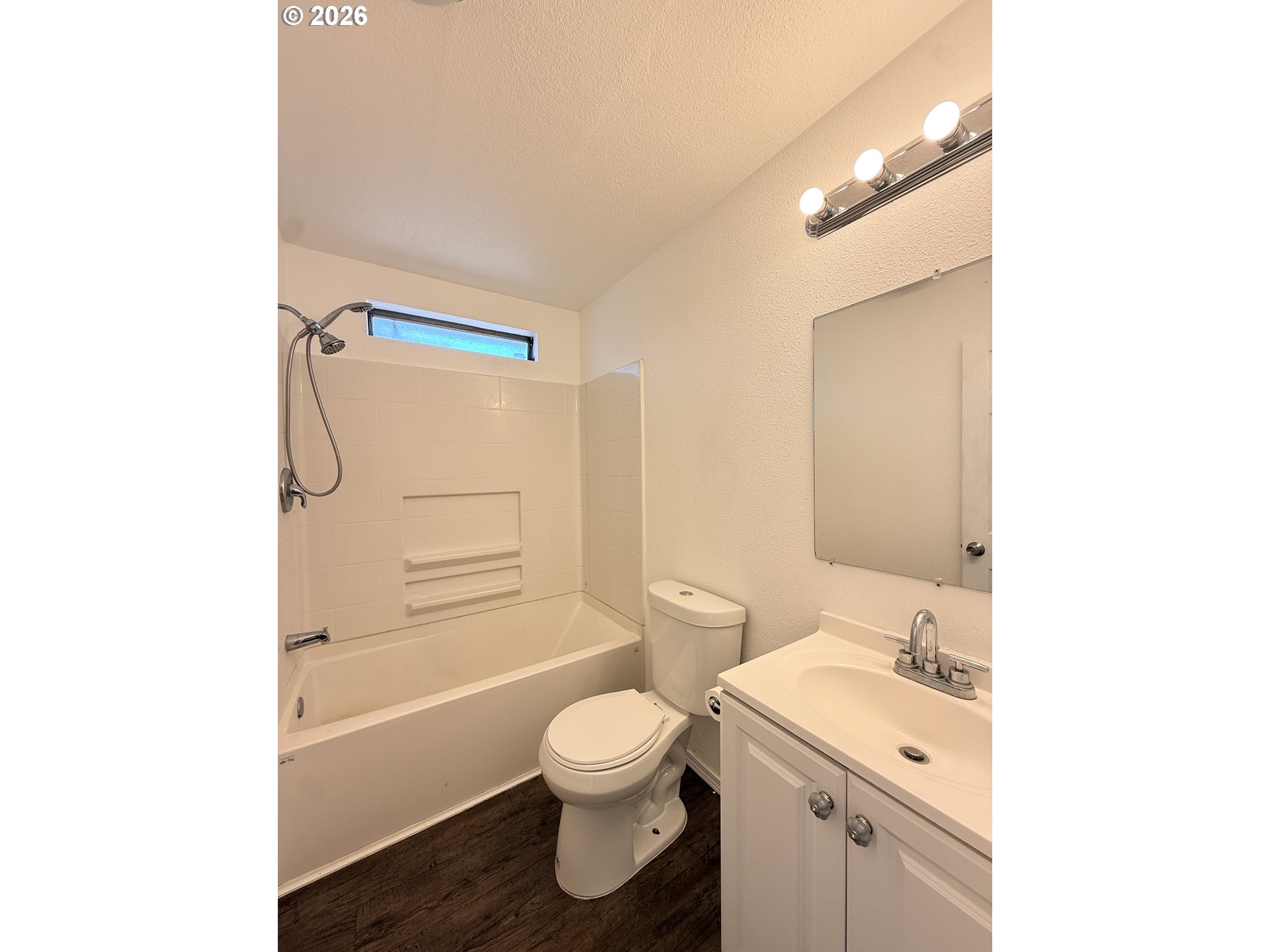 1330 West Sunland Avenue Hermiston, OR 97838 - Photo 11 of 23 a bathroom with a granite countertop toilet sink and mirror