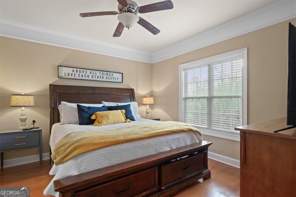 7272 Shellman Bluff Road Northeast, Unit 21 Townsend, GA 31331 - Photo 14 of 33 a bedroom with a bed and a window