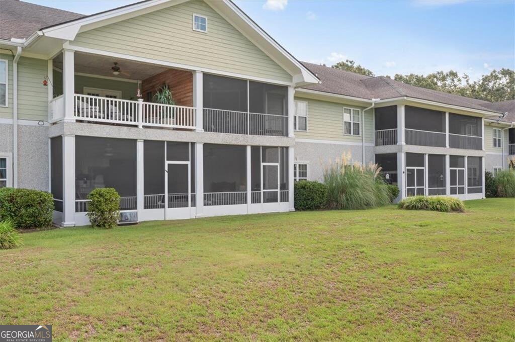 7272 Shellman Bluff Road Northeast, Unit 21 Townsend, GA 31331 - Photo 29 of 33 a view of a building with a garden