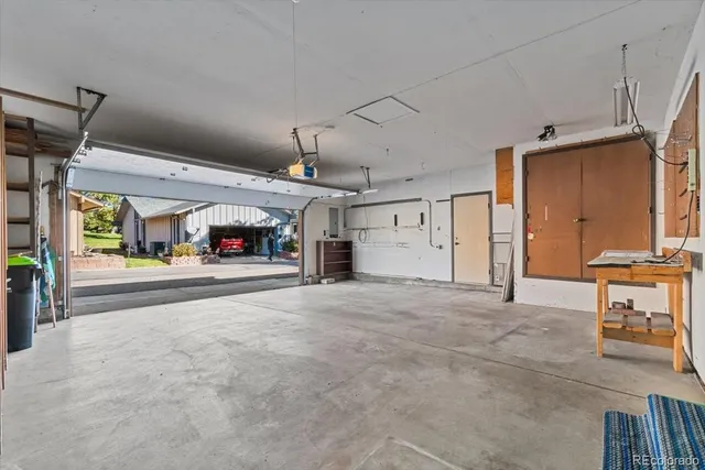 a view of a livingroom with a dinning area and staircase