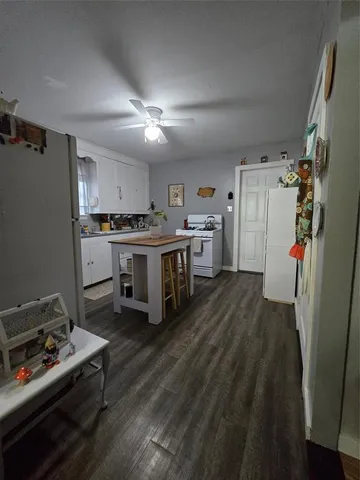 a kitchen with stainless steel appliances a stove a refrigerator and a refrigerator