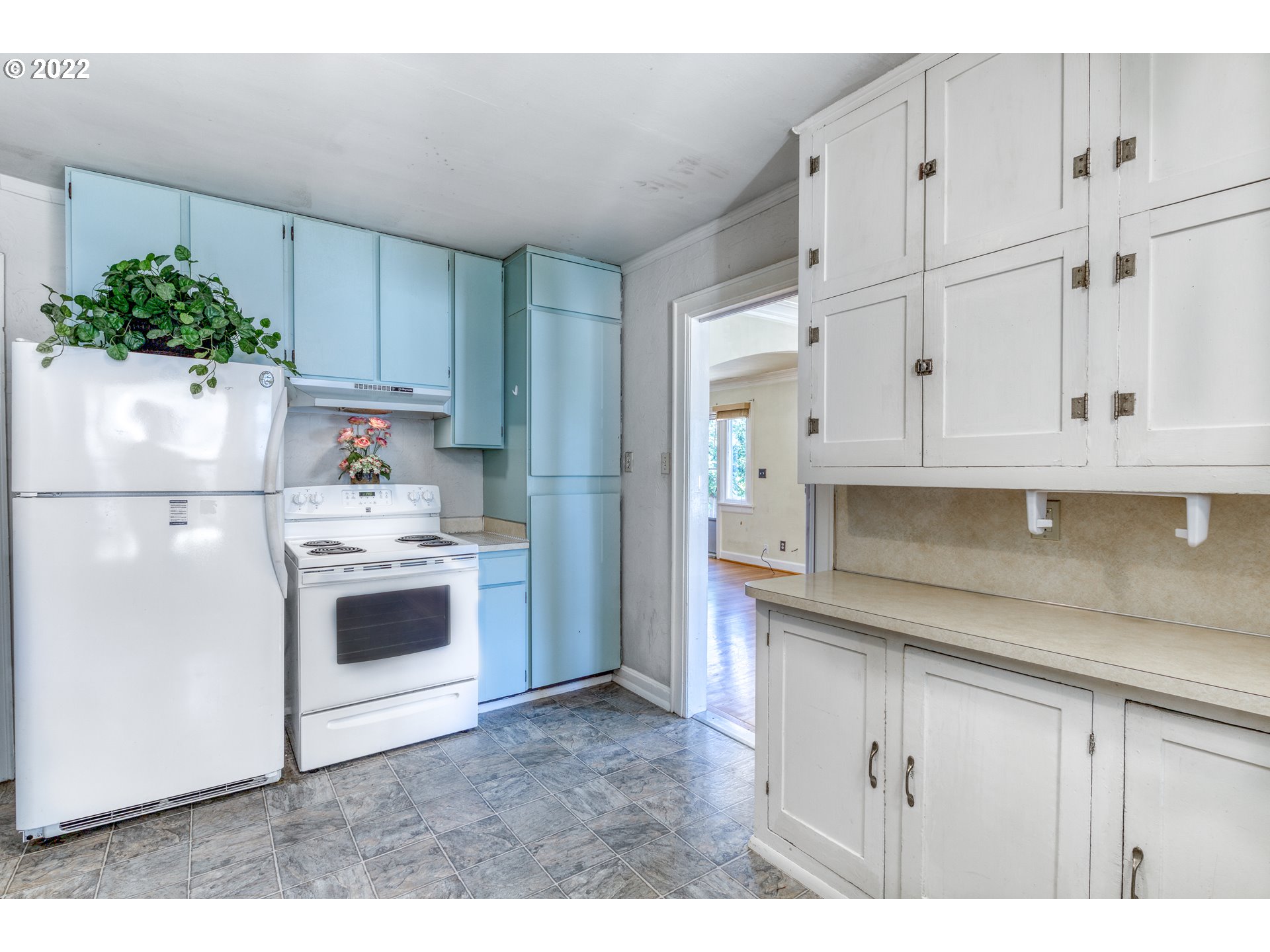 924 Chambers Street Eugene, OR 97402 - Photo 11 of 27 a kitchen with white cabinets and white appliances