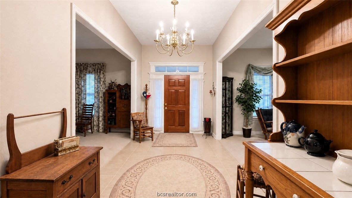 10432 Sammys Road Bremond, TX 76629 - Photo 10 of 47 a very nice looking room with a large bed a chandelier and closet