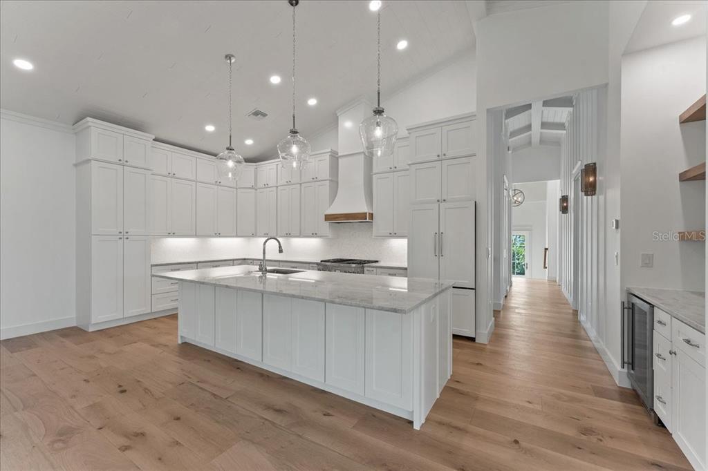 847 Belcher Road Boca Grande, FL 33921 - Photo 17 of 74 a large kitchen with stainless steel appliances a large counter top a refrigerator and a sink