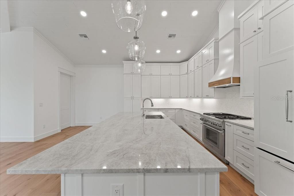 847 Belcher Road Boca Grande, FL 33921 - Photo 18 of 74 a kitchen with granite countertop a stove and a sink